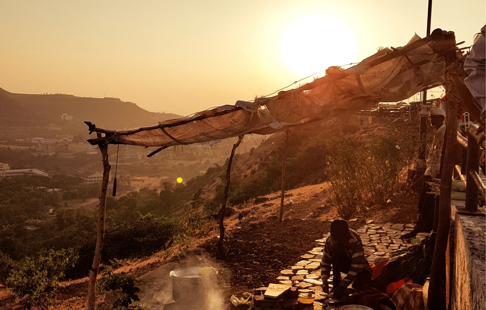 Natives working away in the backdrop of Saputara Hill Station sunrise © Tarak Patel/Unsplash